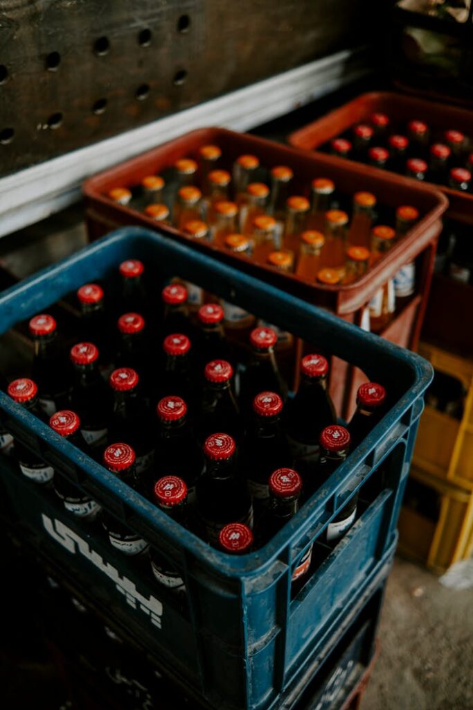 Multiple crates containing beer bottles neatly stacked, showcasing a vibrant storage display.